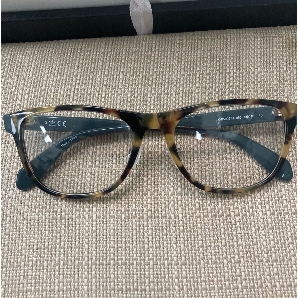 Adidas tortoise front with green temple frames